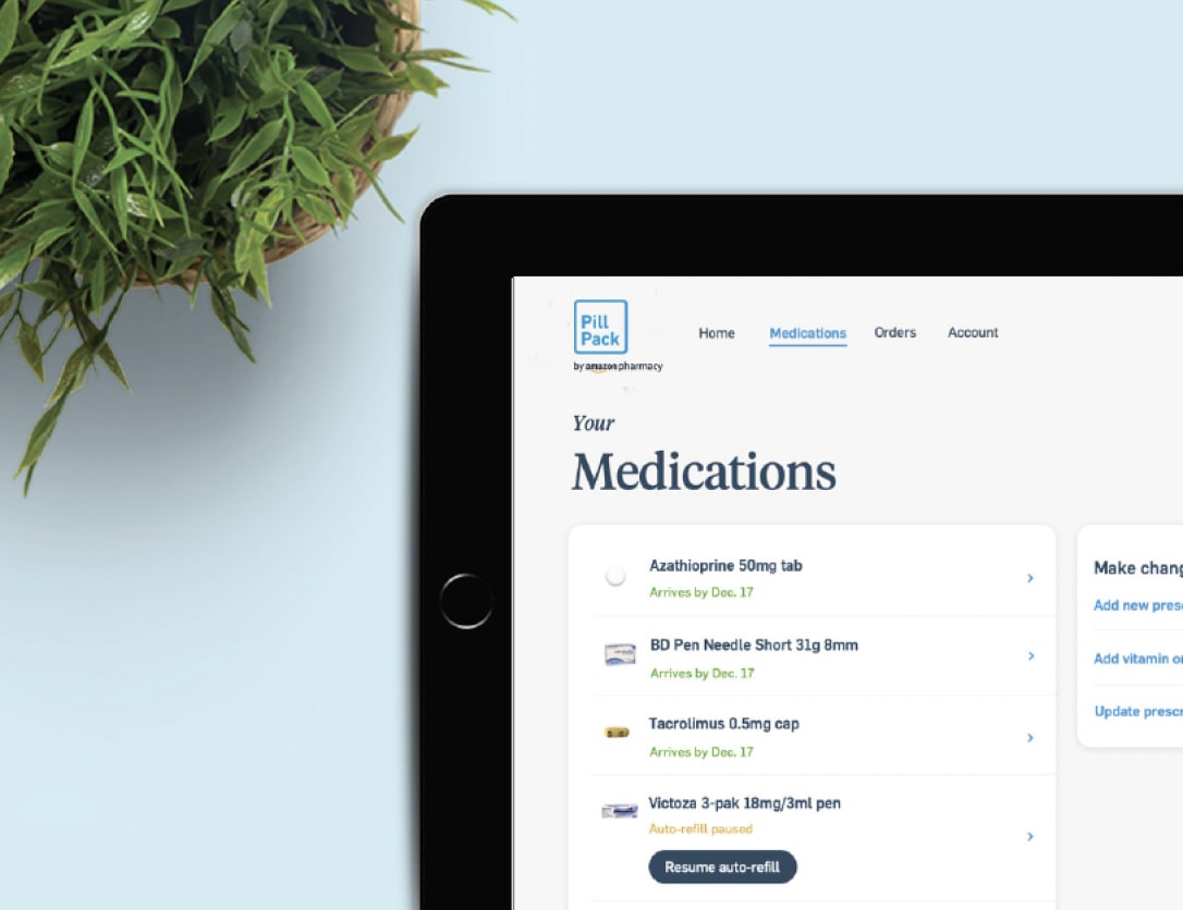 A plant and tablet displaying PillPack dashboard app