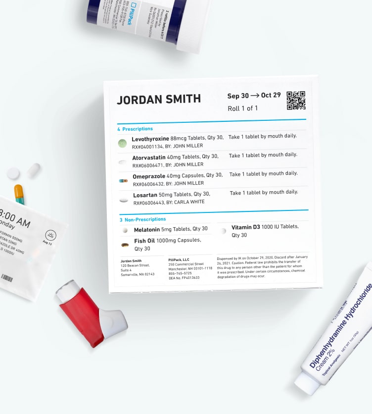 PillPack medication dispenser with pills, inhaler, cream, and pill bottle